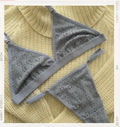 Lencería Perla Gris - conjunto gris de encaje ojales tipo triangulo, sobre sueter tejido amarillo - Seduxxion